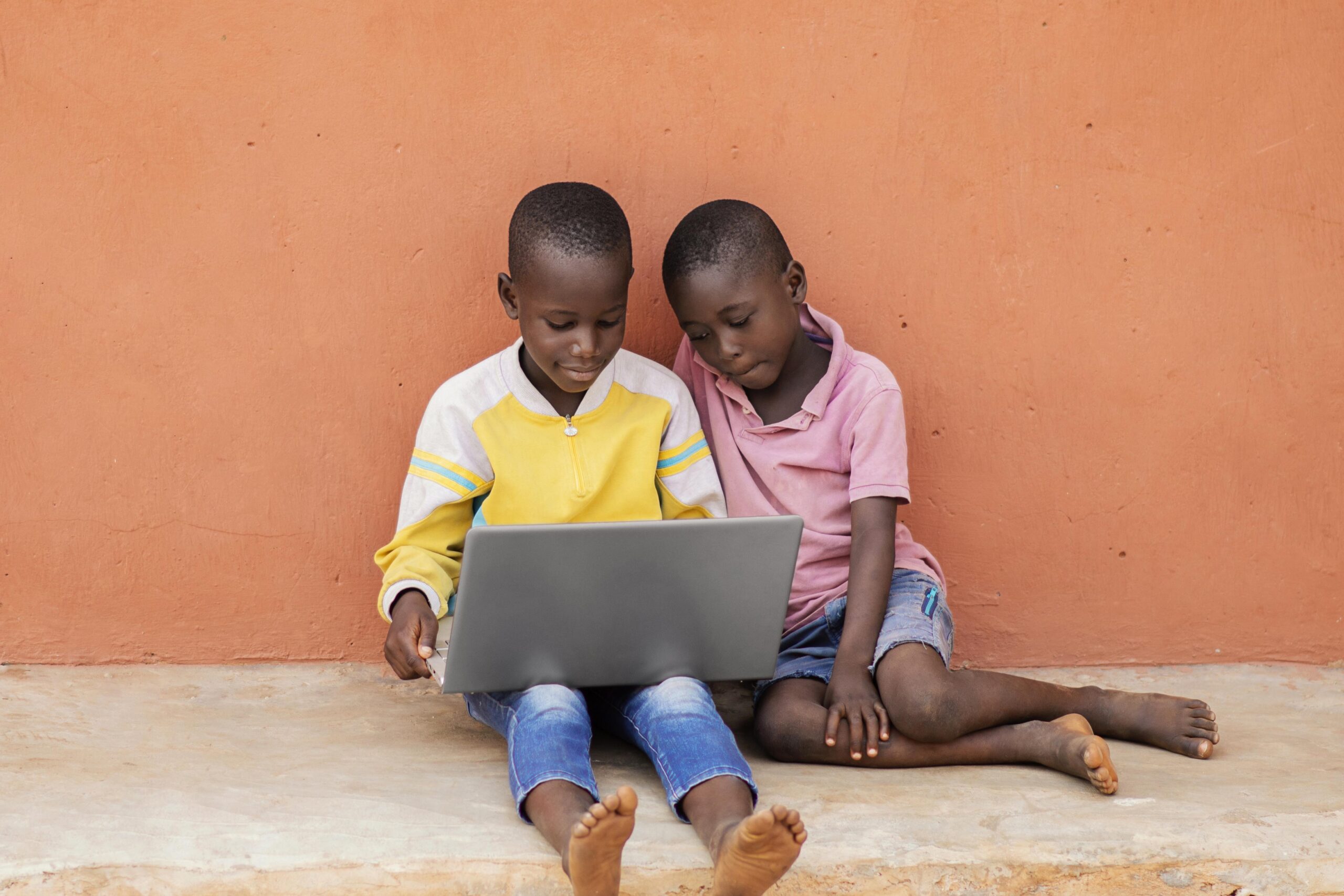 full-shot-african-kids-with-laptop